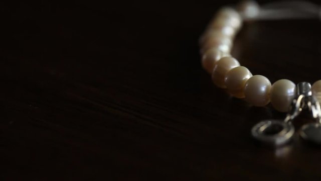 Silver Heart and Yellow Pearl Jewelry with stone Macro shooting travel on the slider