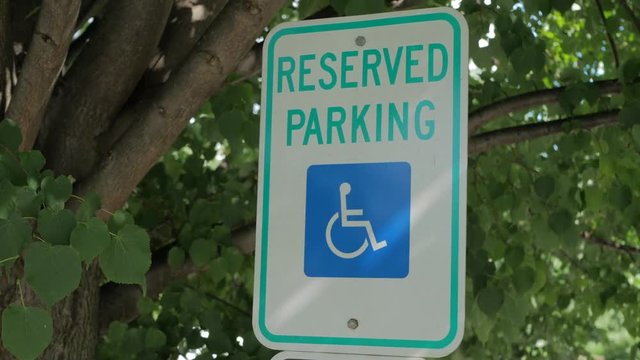 Reserved Parking sign outside infront of trees