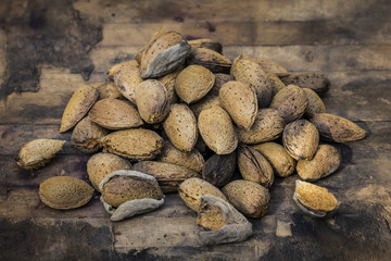 Almonds on an old wood background