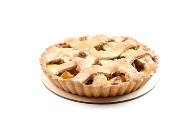 Traditional American Thanks Giving lattice pie isolated on white background. Homemade fruit tart baked to golden crust. Close up, copy space, top view.