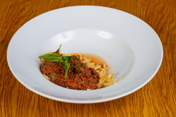 Pasta Bolognese with basil