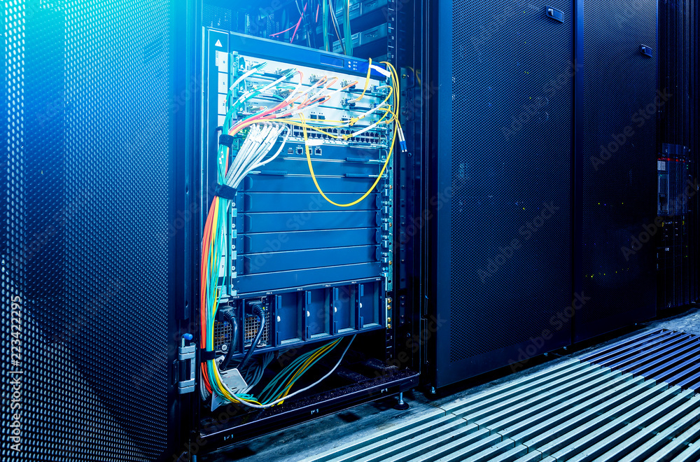 Poster image presents a bottom view of a room equipped with data servers. blue led lights are flashing.