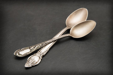 Vintage metal spoon on dark background