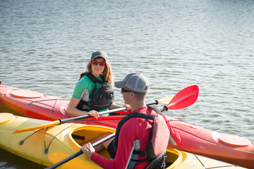 Two people in kayaks on the river