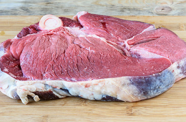 Close up. Fresh meat beef ham on a cutting board