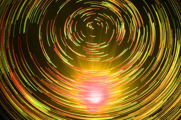 yellow vortex light trails effect created fiber optic light
