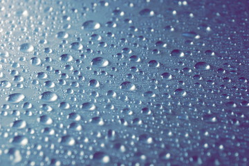 water drops on grey blue steel background texture