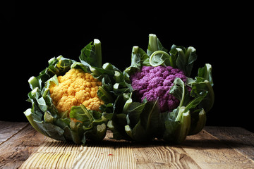 Colorful cauliflower cabbages on table. Healthy food.