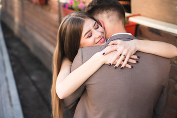 A pair of lovers posing on the camera.