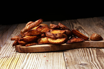 Baked potato wedges. homemade organic vegetable vegan vegetarian potato wedges snack food