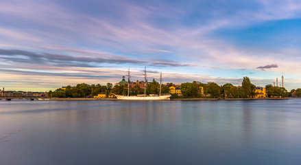 Naklejka premium Sailing boat by the old town of Stockholm, Sweden