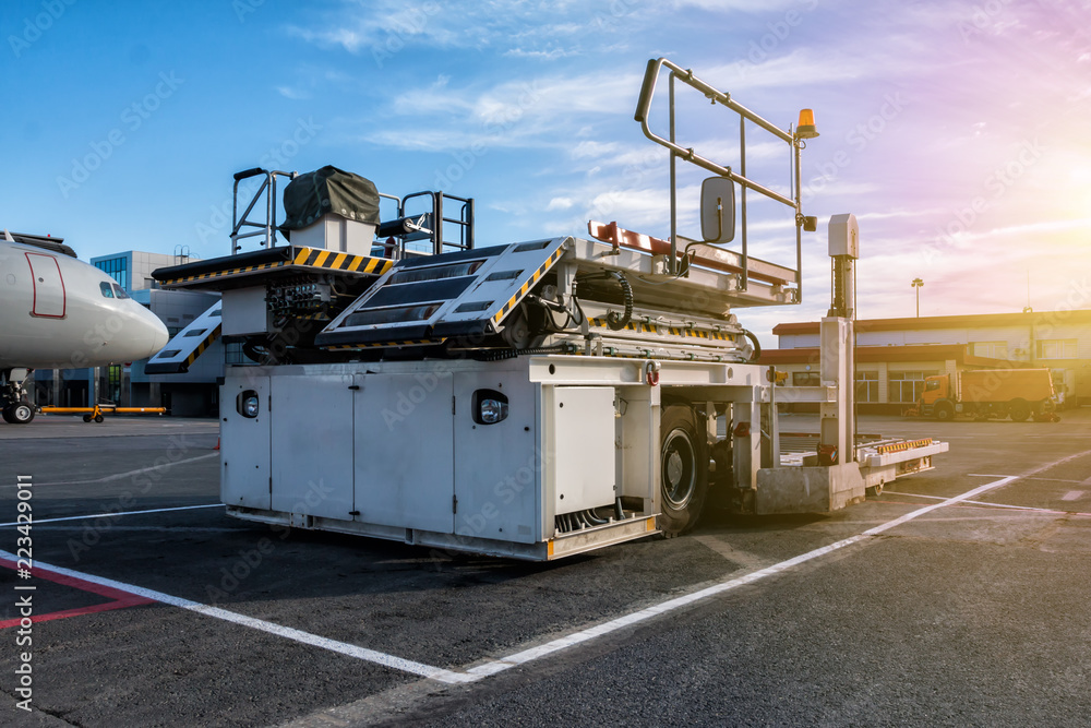 Wall mural Aircraft container and pallet loader at the airport apron