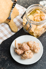 Pickled cauliflower on plate.