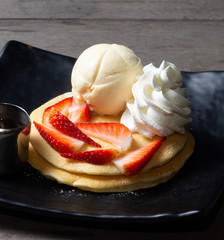Strawberry pancakes with vanilla ice cream