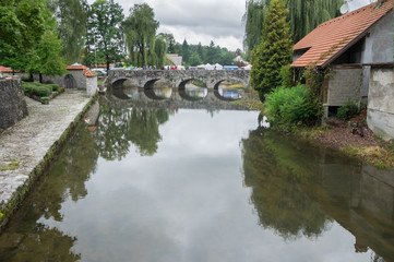 Obraz premium The pastoral view on French Bridge over the Bistrica River in Ribnica town. Slovenia