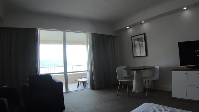 POV, walking to balcony of hotel