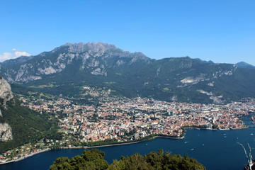 Fototapeta na wymiar Mount Resegone and city of Lecco (northern Italy) aerial view between mountains and lake in summer