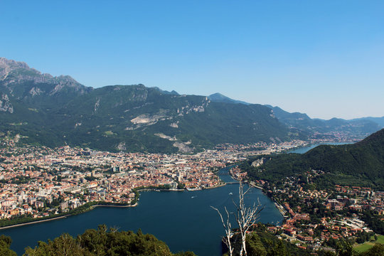 Aerial view of Lecco city between mountains lake and Adda river in northern Italy