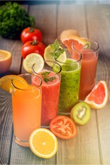 Flasses of various juice with ingredients