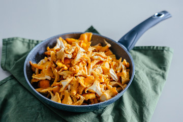 Autumn mushrooms, cook in a pan, chanterelles