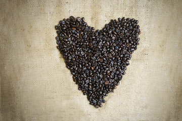 Roasted coffee beans shaped heart symbol