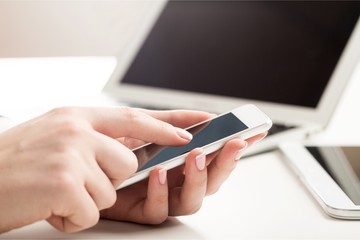 Young business man hands using mobile