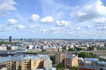 Great city view to town from the height with clouds