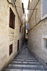 Fototapeta na wymiar Small street in old town in Europe