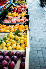 Street fruit market of peaches and plums in summer Italy