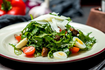 salad with arugula and fried mushrooms