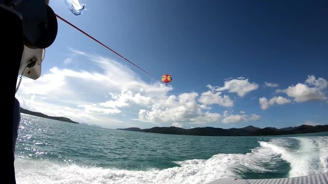 Boat tugs parasailer in Australia, POV
