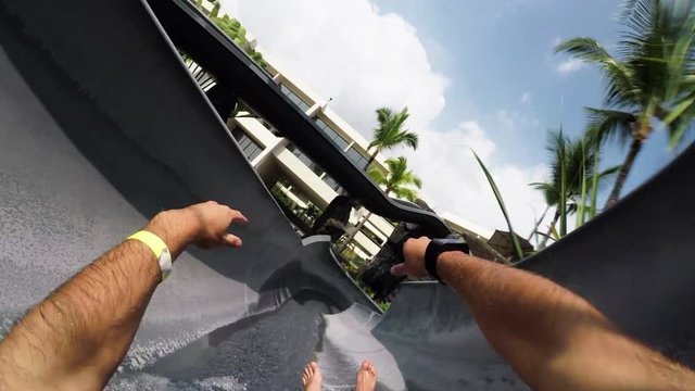 Person slides down water slide, POV