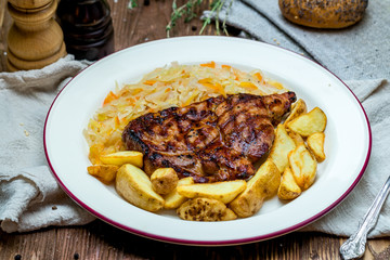Fried pork loin with cabbage and potatoes