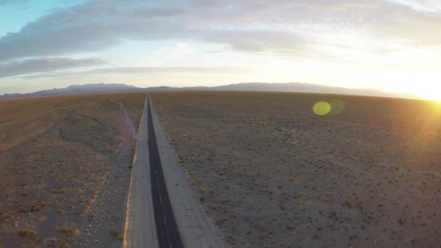 Wide aerial, empty road in desert