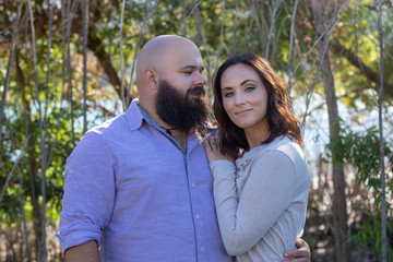 Obraz premium Close up of loving couple by the lake boyfriend looking at her face