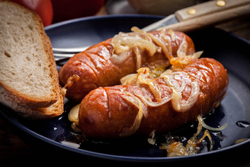 Fried sausage with onions.
