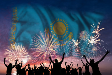 People are looking on fireworks and flag of Kazakhstan