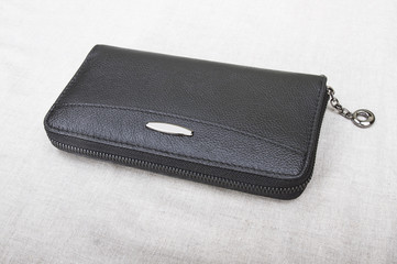 closed men's wallet; black purse