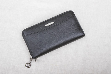 closed men's wallet; black purse