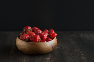 strawberry on a dark background of wood