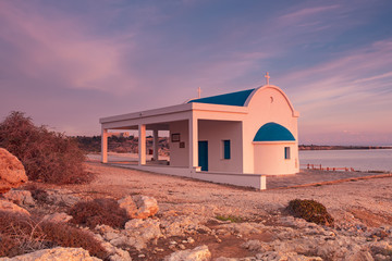 Cyprus, Mediterranean Sea coast. Agioi Anargyroi church at Cape Greco at sunrise