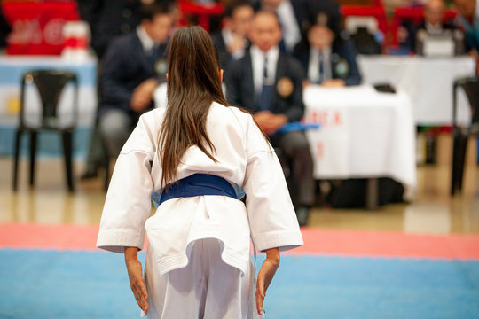 girl karatek preparing to make kata at the championship
