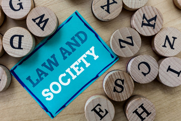 Writing note showing Law And Society. Business photo showcasing Address the mutual relationship...