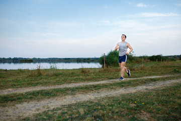 Sport and fitness runner man doing outdoors training for marathon run.