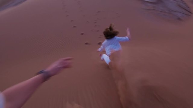 Jumping off desert dune, POV