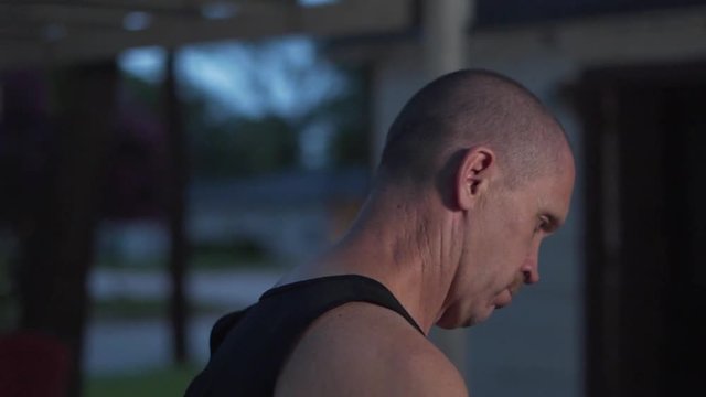 A sad lonely man takes a walk.