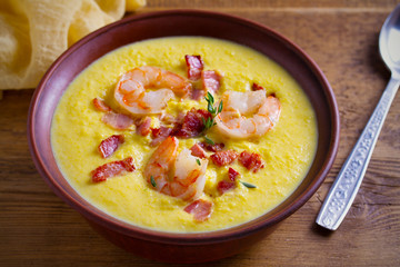 Shrimp, bacon and corn chowder. Creamy corn vegetable soup with shrimps and bacon. horizontal