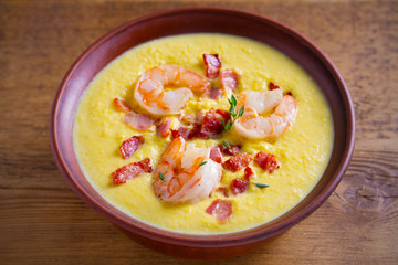 Shrimp, bacon and corn chowder. Creamy corn vegetable soup with shrimps and bacon. horizontal