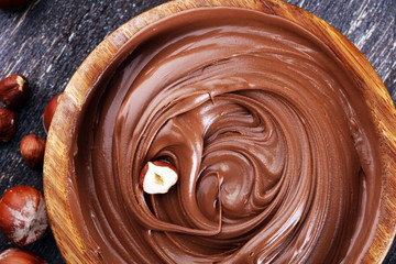 Homemade hazelnut spread in wooden bowl. Hazelnut Nougat cream