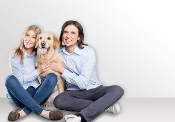 Young couple in new apartment with  dog